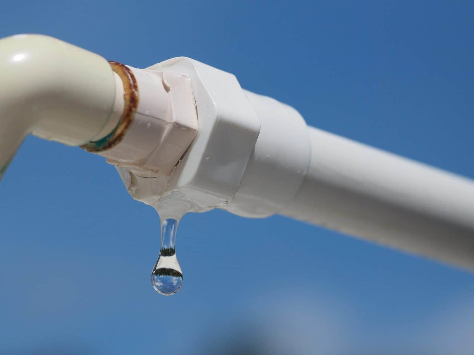 Plastic pipe with water`s leak.
